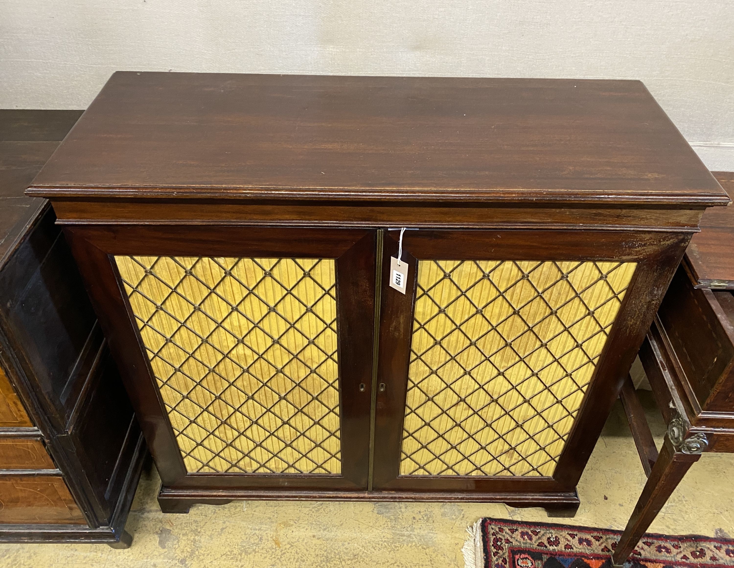 A mahogany chiffonier with two grill doors, width 109cm, depth 42cm, height 104cm